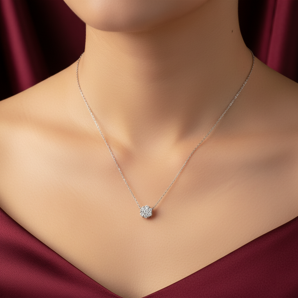 Necklace with a floral pendant on a mannequin against a red fabric background