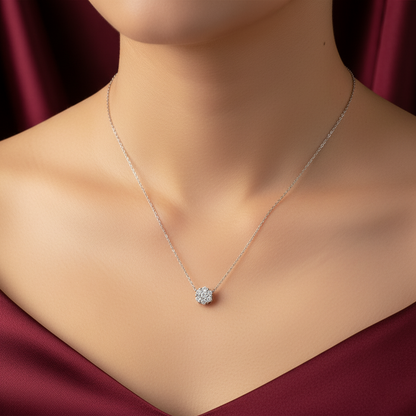 Necklace with a floral pendant on a mannequin against a red fabric background