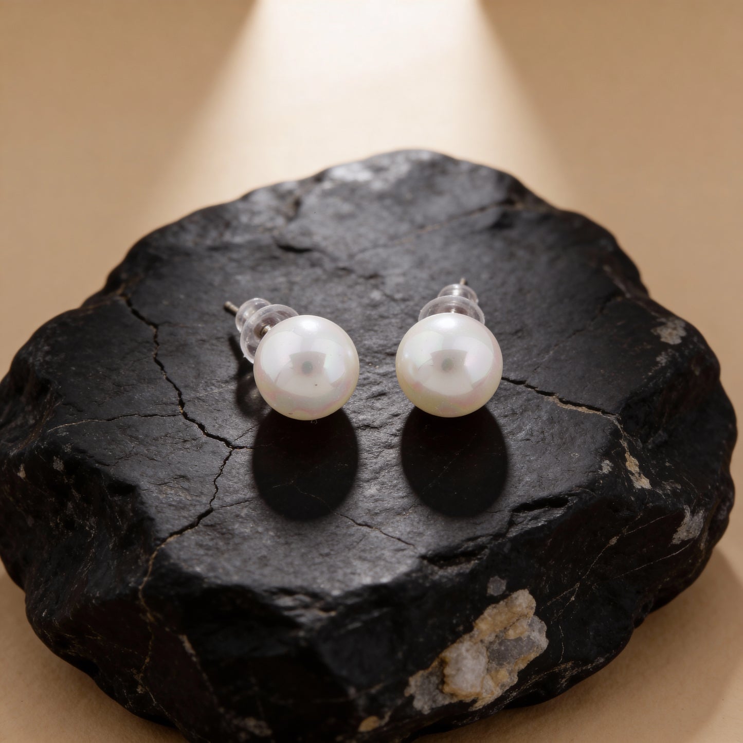 Pearl earrings on a light background