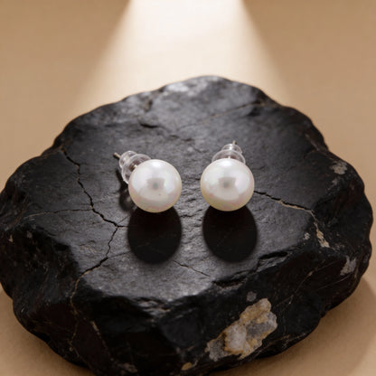 Pearl earrings on a light background