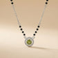 Modern mangalsutra necklace with black beads and green center stone halo design