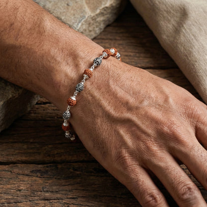 Silver bracelet with natural rudraksha beads in flat lay style