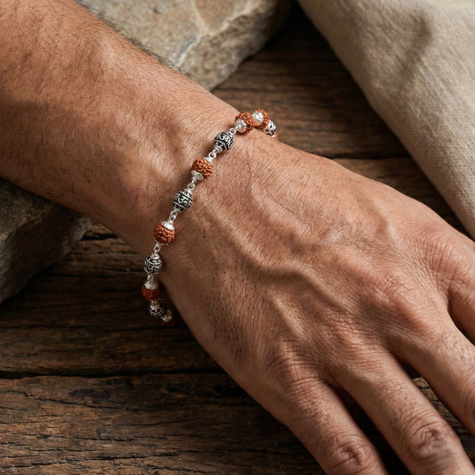 Silver bracelet with natural rudraksha beads in flat lay style