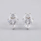 Pair of diamond earrings on a light gray background