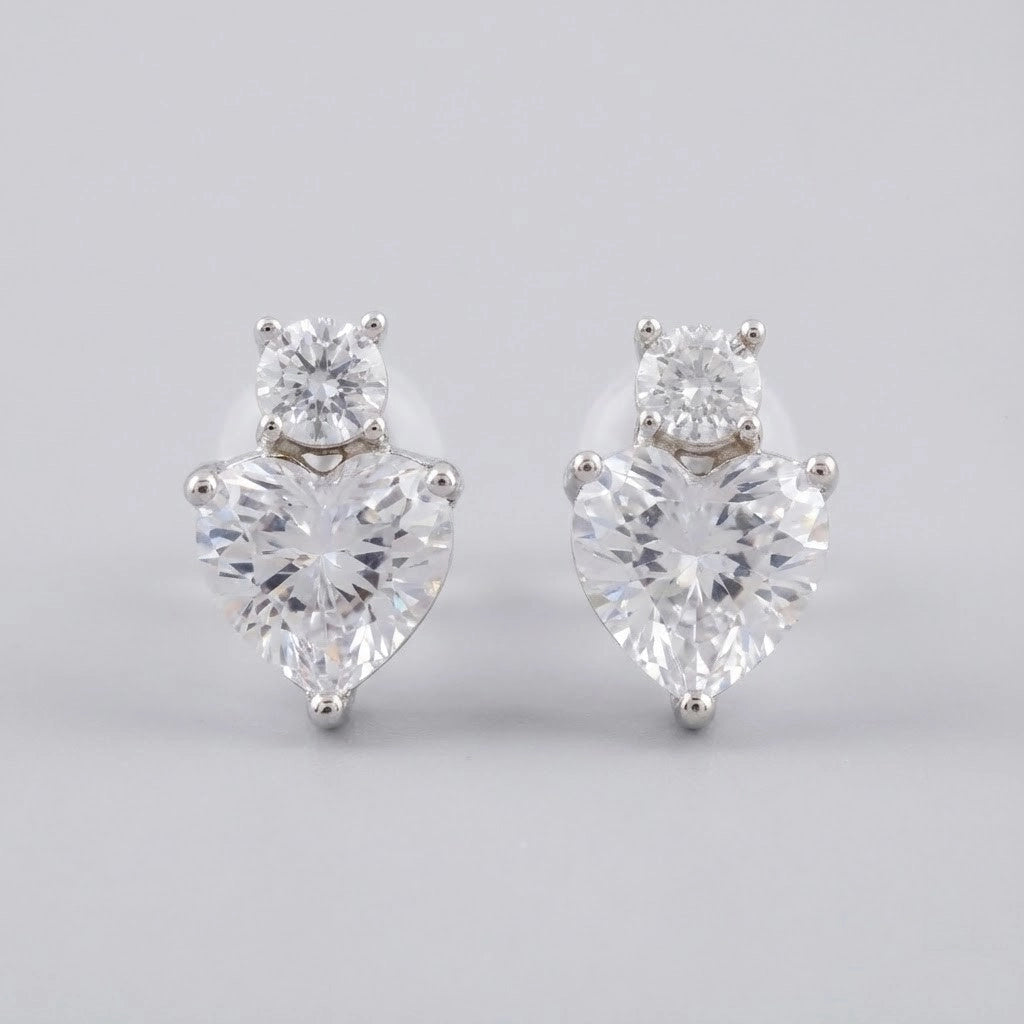 Pair of diamond earrings on a light gray background