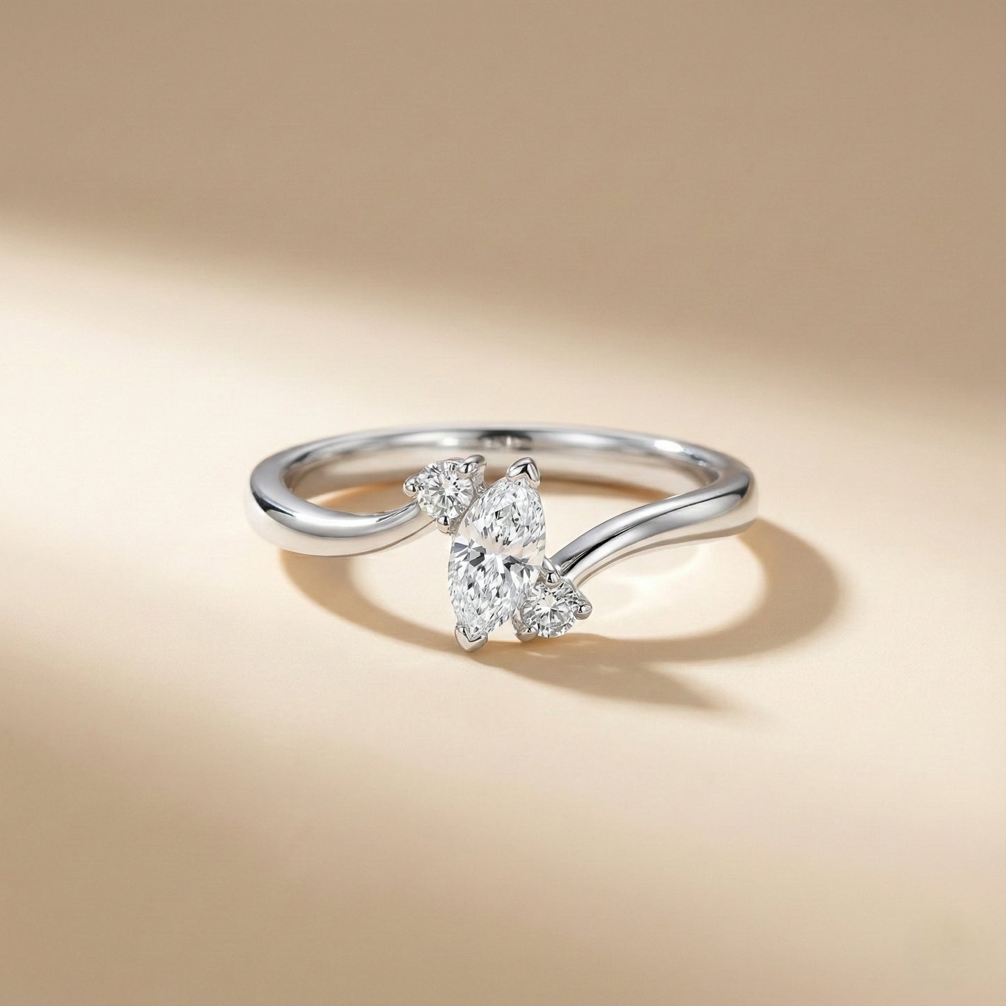 Silver ring with a diamond on a beige background