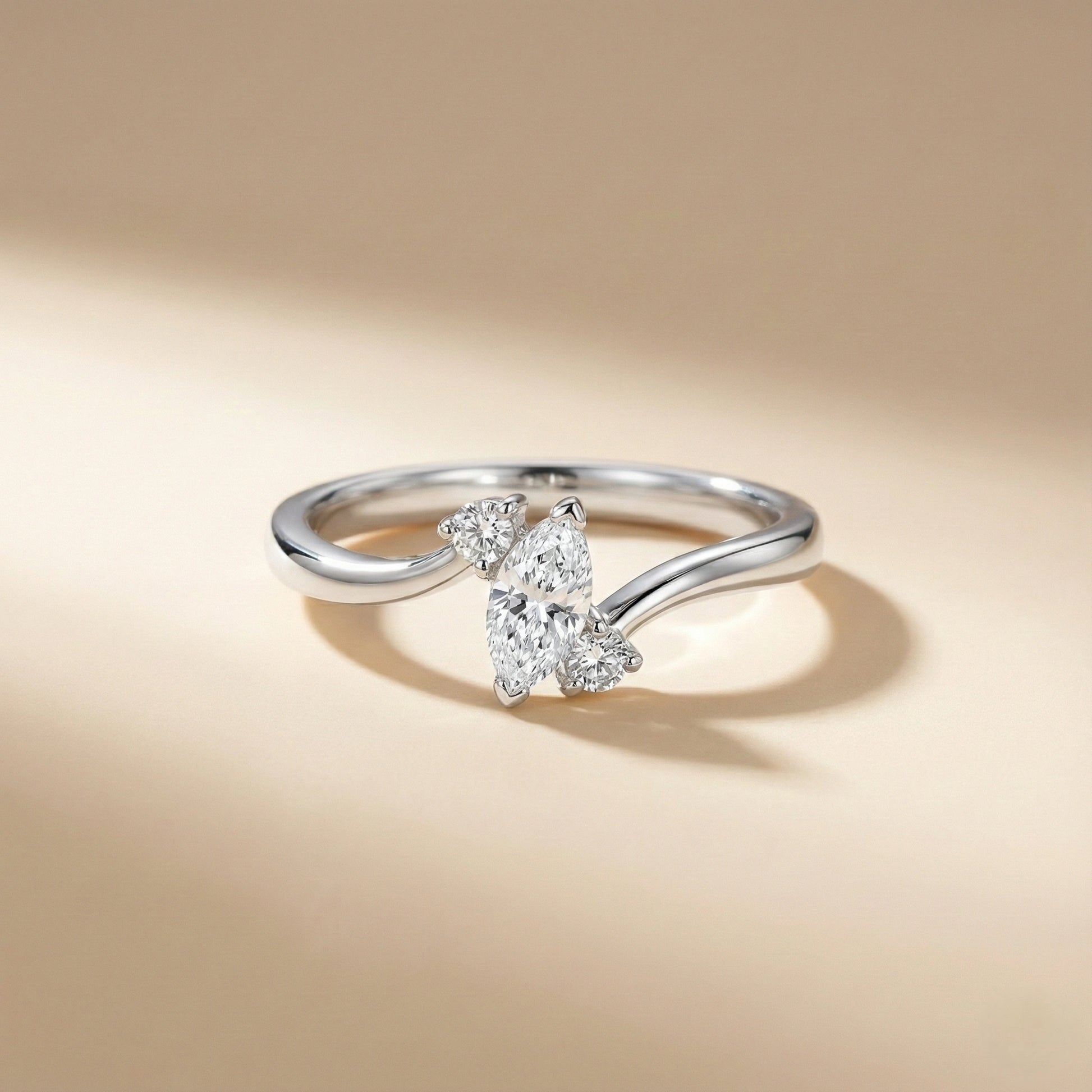 Silver ring with a diamond on a beige background