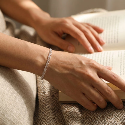 Modern sterling silver chain bracelet flat lay