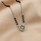 925 sterling silver mangalsutra with black beads and a green stone halo pendant