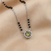 925 sterling silver mangalsutra with black beads and a green stone halo pendant