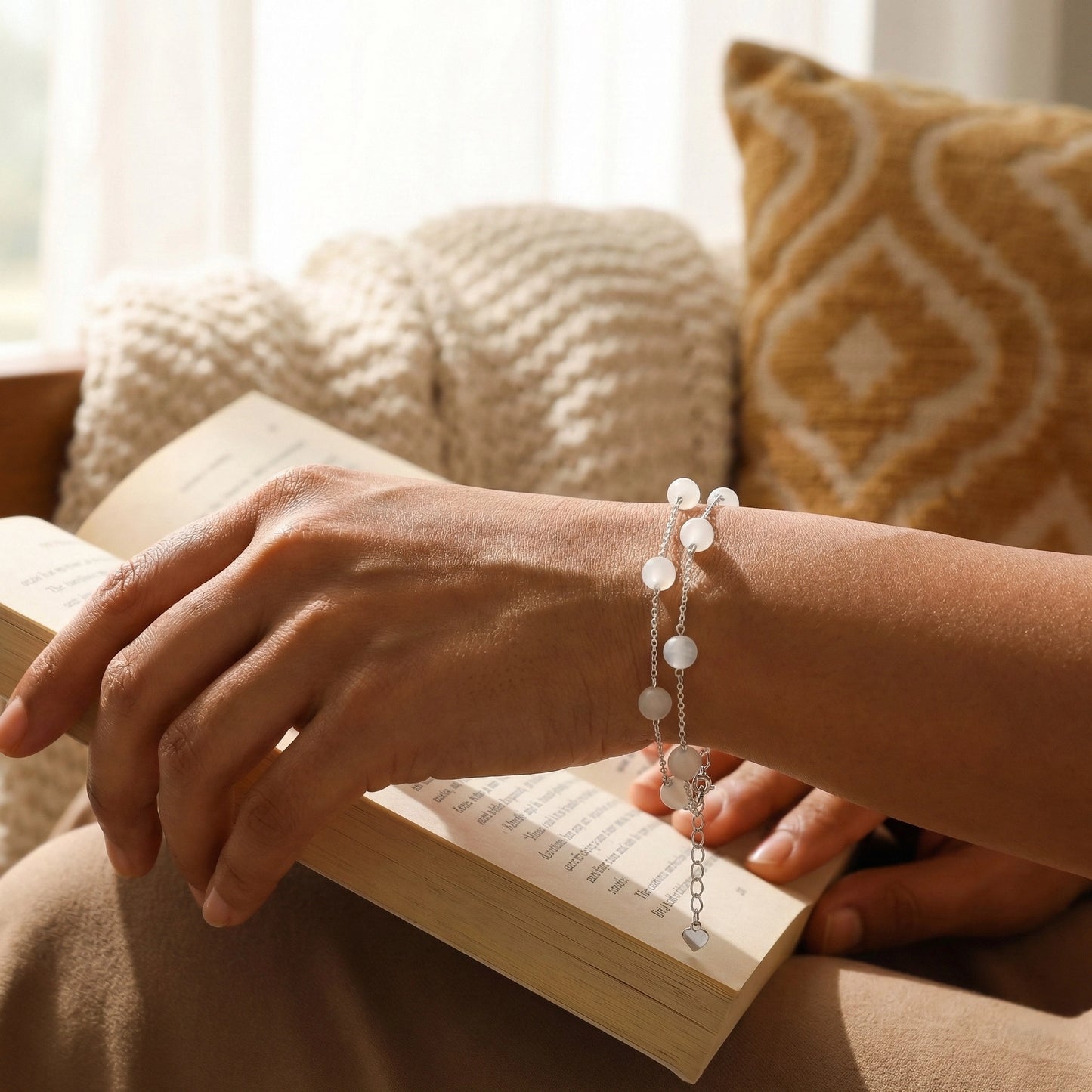 Silver pearl bracelet styled on hand during reading