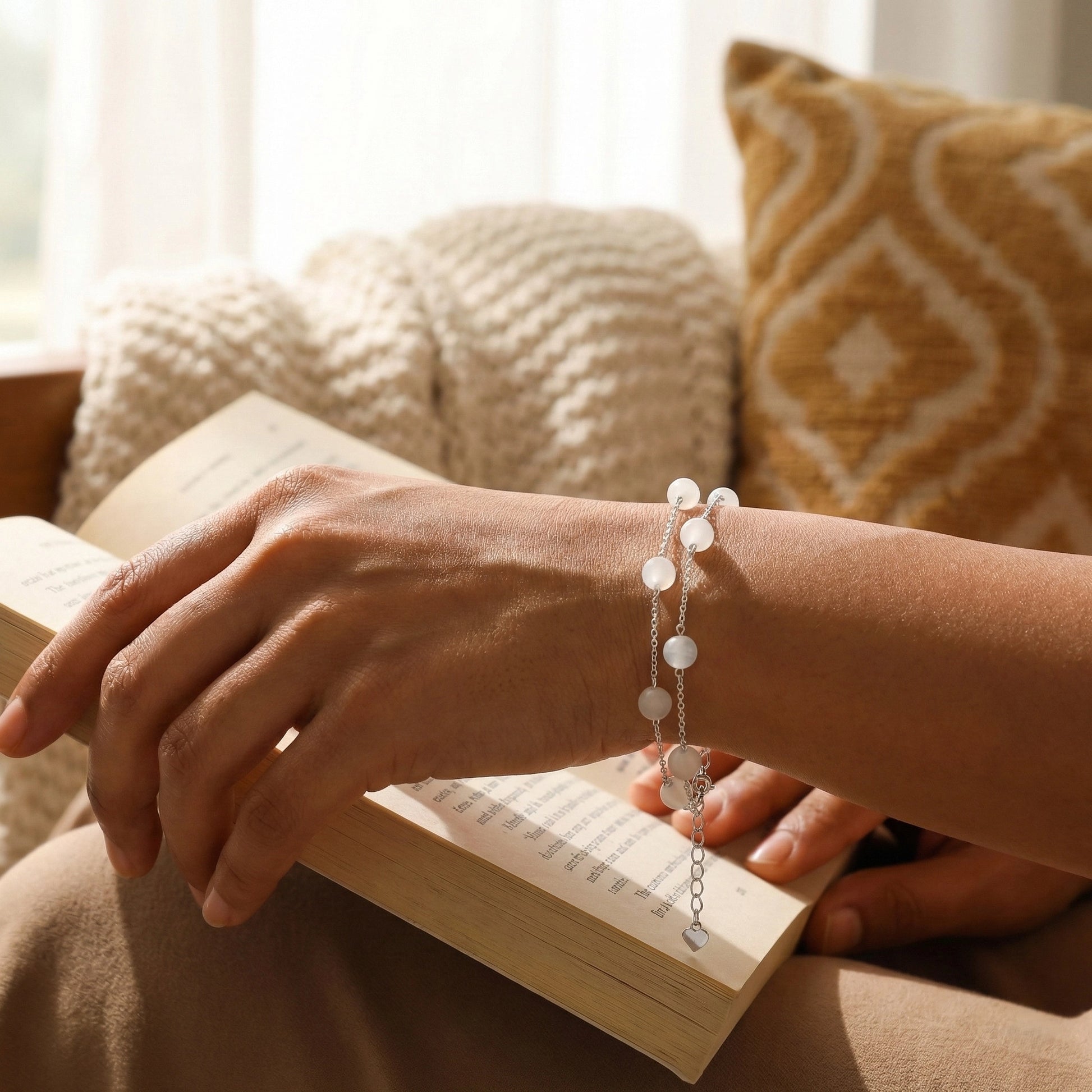 Silver pearl bracelet styled on hand during reading