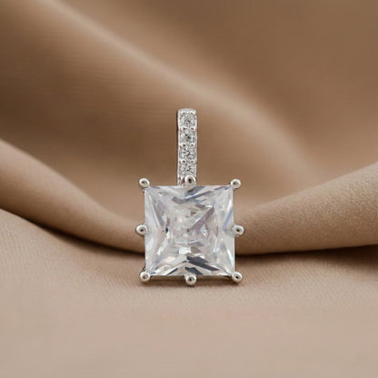 Diamond pendant on a beige fabric background