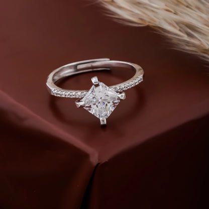 Diamond ring on a brown fabric background