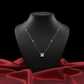 Silver necklace with a square pendant on a black mannequin bust against a red fabric background