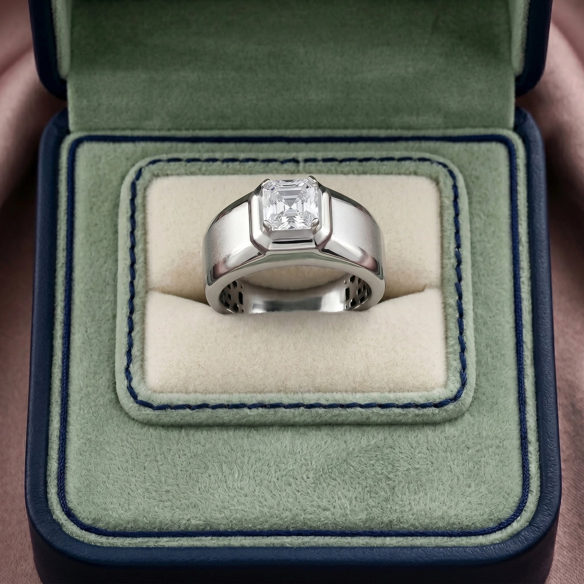 Silver ring with a diamond in a green velvet box