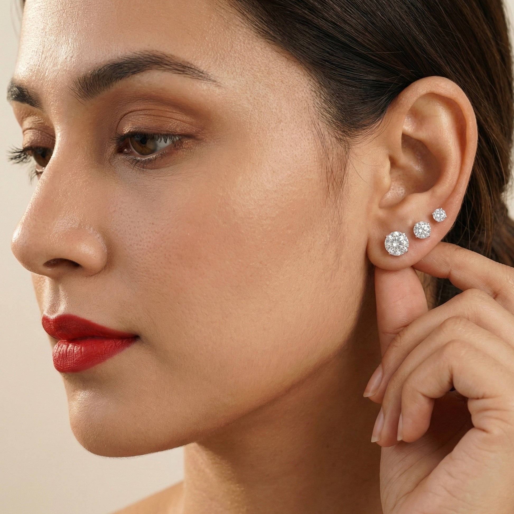 Minimalist sterling silver stud earrings with diamond-look cubic zirconia stones