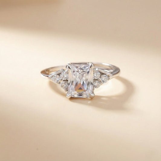 Diamond ring with a square-cut gemstone on a beige background