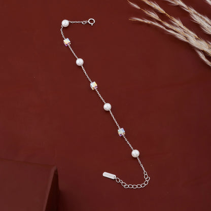 Pearl bracelet on a brown background