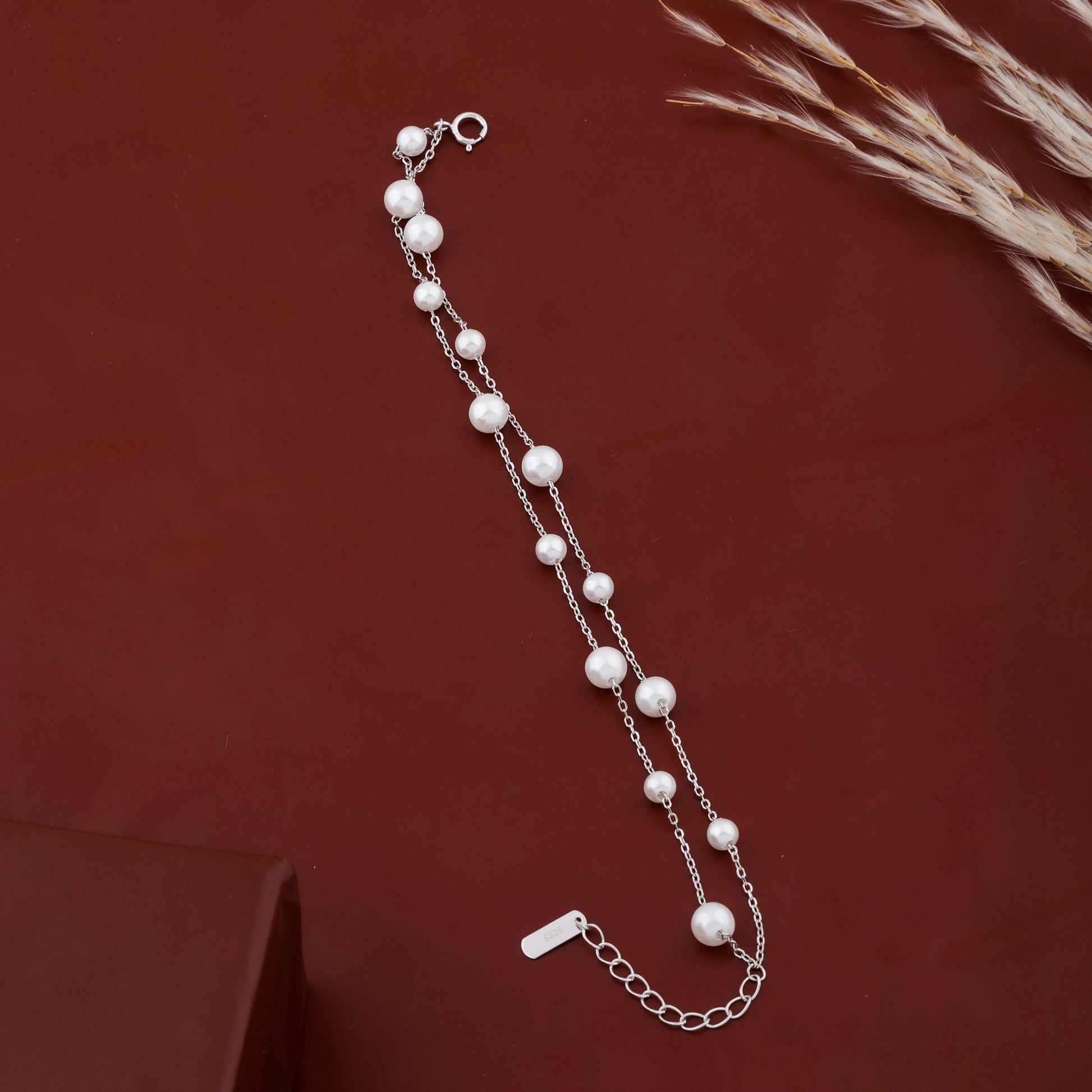 Dainty pearl chain bracelet with extension chain detail