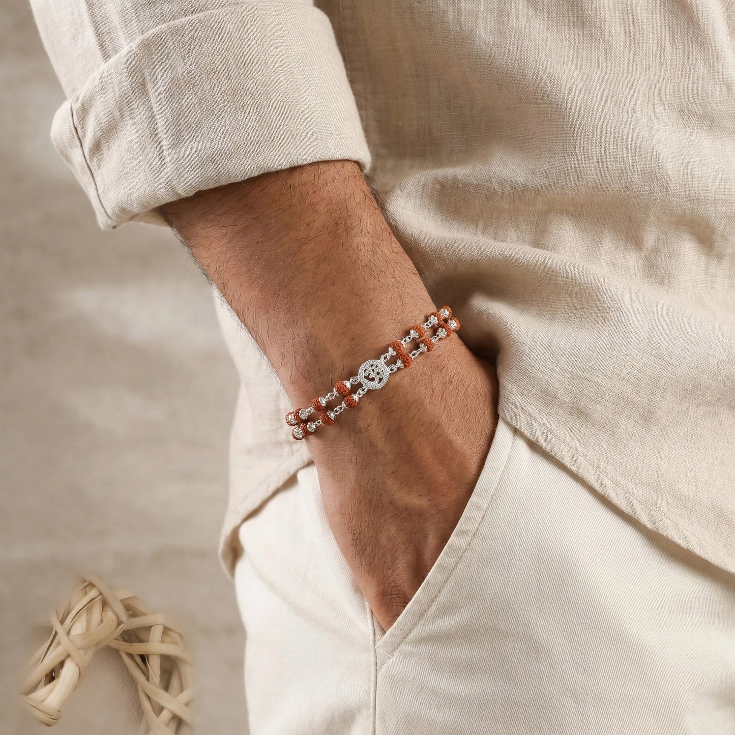 Person wearing a bracelet with a neutral background
