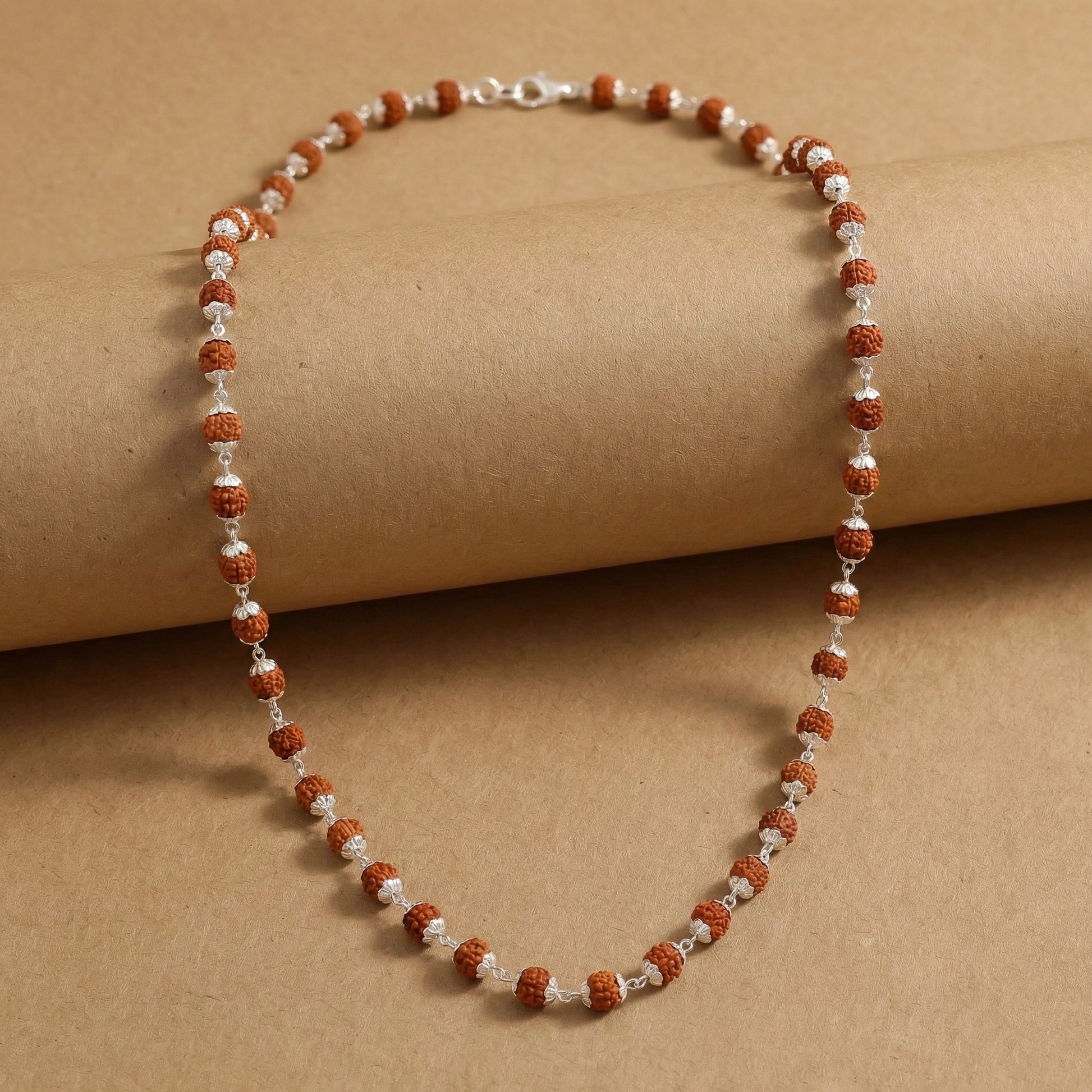 Beaded necklace on a brown background