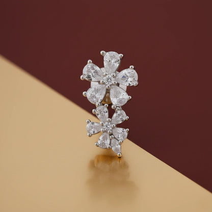 Diamond earring on a gold and brown gradient background