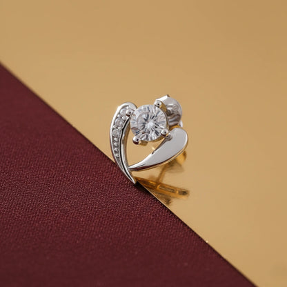 Silver ring with a large central gemstone on a brown fabric background